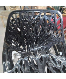 LOT 4 CHAISES NOIRES NID D\'ABEILLE PLASTIQUE PIEDS CHROMÉS