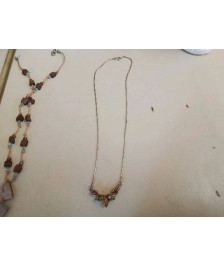 COLLIER AVEC DES PIERRES D’AMBRE